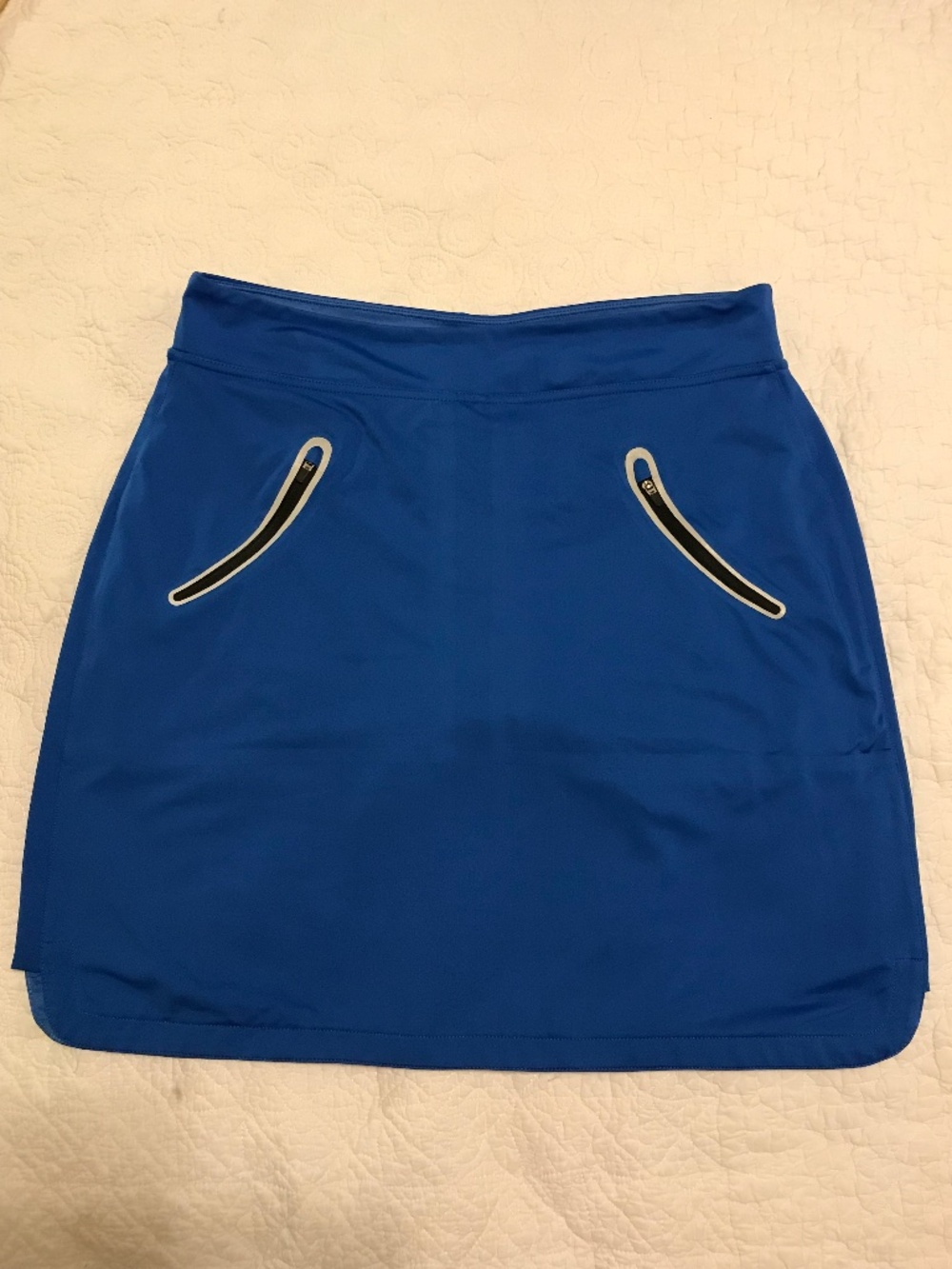 Sunice cobalt blue pull-on sport skort with zippered pockets (M)